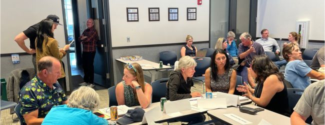 Group of people having breakout conversations